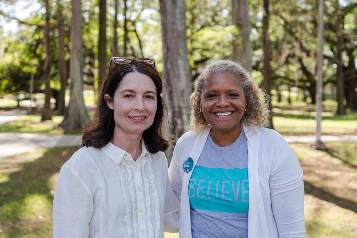 Executive Director of the Student Health Center Julie Hupperich (left) and Director of the Lighthouse Program Kreslyn Kelley-Ellis (right) stand for a photo Tuesday, March 26, 2024, at the Believe March on LSU's campus.