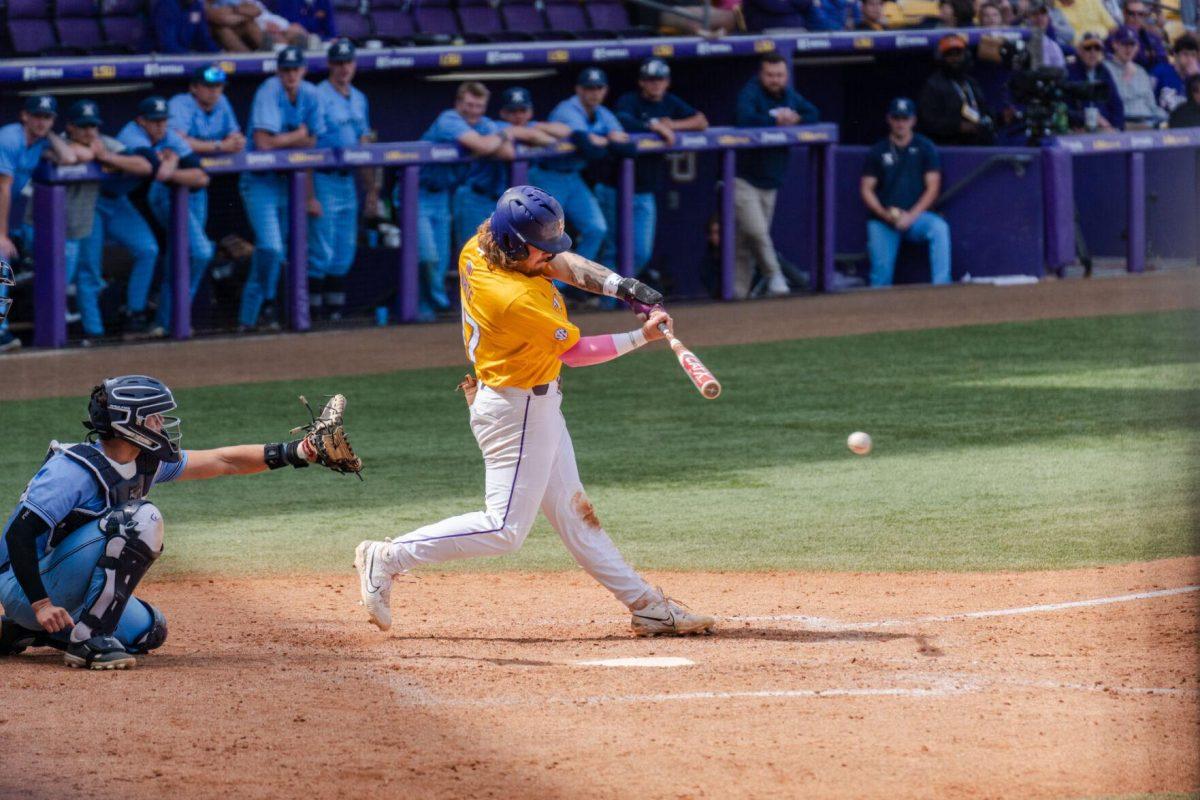 LSU baseball junior third baseman Tommy White (44) hits the ball Sunday, March 10, 2024, during LSU's 2-1 loss to Xavier in Alex Box Stadium in Baton Rouge, La.