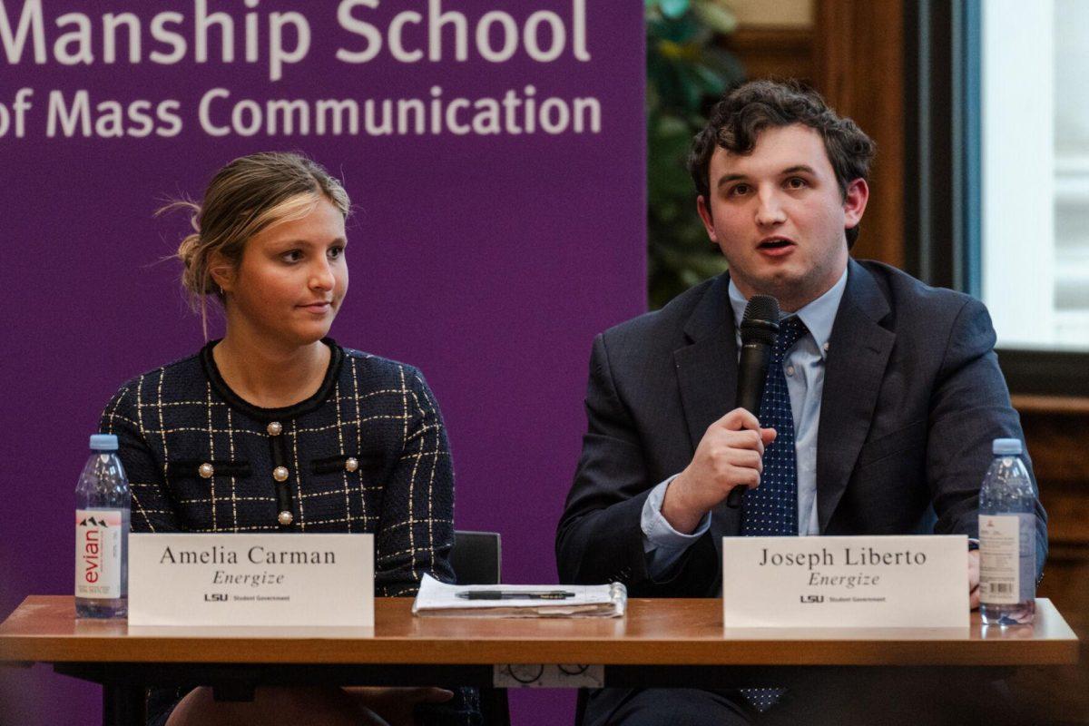 Joseph Liberto answers a question as Amelia Carman listens Monday, March 18, 2024, inside the Holliday Forum at LSU in Baton Rouge, La.