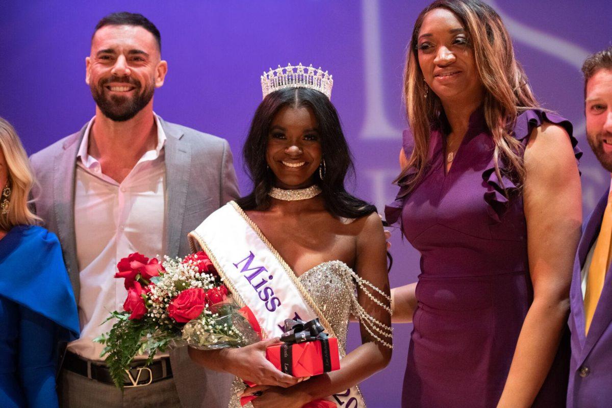 LSU kinesiology sophomore Nikhia Sims poses with judges as Miss LSU Sunday, March 24, 2024, during Delta Zeta's Miss LSU 2024 Pageant in the Union Theater in Baton Rouge, La.