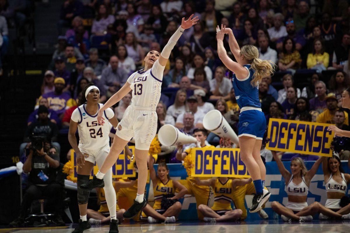 LSU women&#8217;s basketball junior guard Lear-Tear Poa (13) jumps to block the ball Sunday, March 24, 2024, during LSU&#8217;s 83-56 second-round NCAA tournament win against Middle Tennessee at the Pete Maravich Center in Baton Rouge, La.