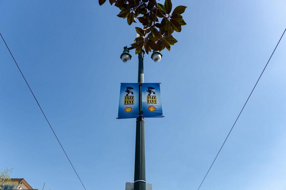 Jazz Fest banners hang from a lamppost Friday, March 29, 2024, on North Rampart Street in New Orleans, La.