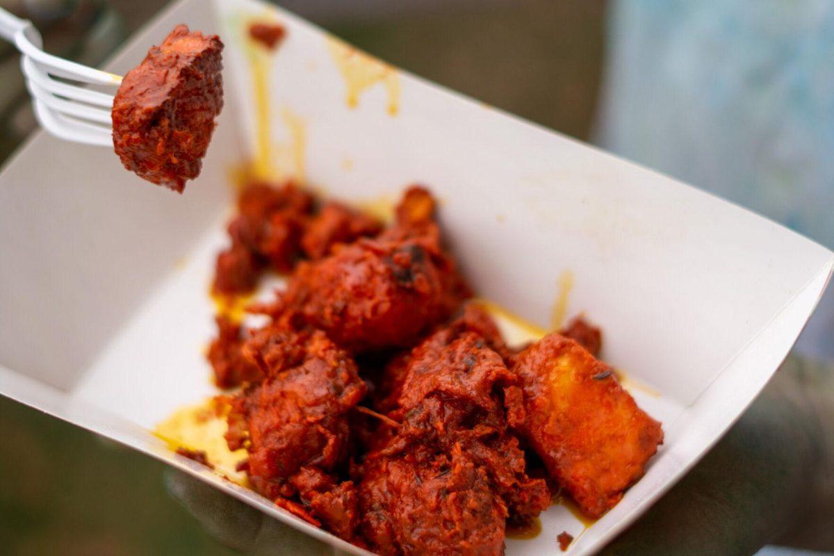 A plate of chicken 65 sits Saturday, March 9, 2024, at the Holi Festival at Repentance Park in Baton Rouge La.