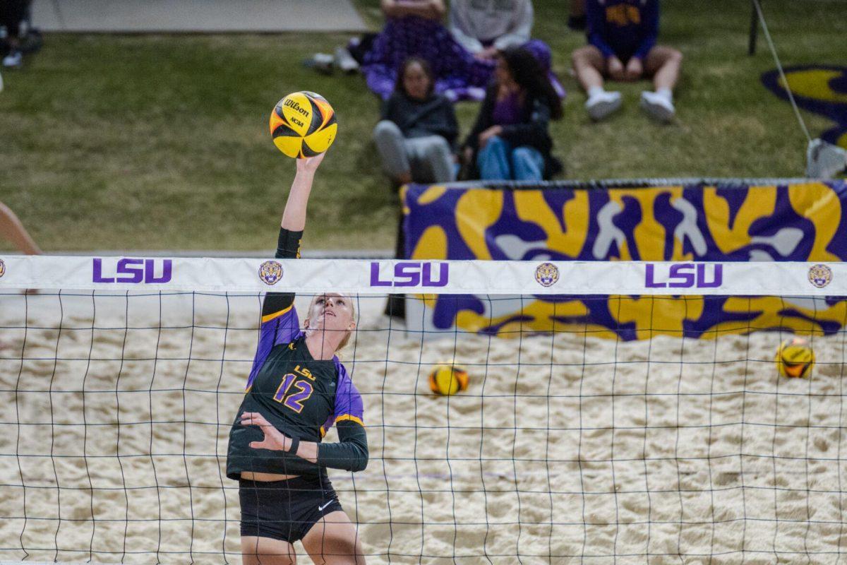 LSU beach volleyball senior Amber Haynes (12) hits the ball Saturday, March 2, 2024, during LSU&#8217;s 5-0 win against Nebraska at the LSU Beach Volleyball Stadium in Baton Rouge, La.