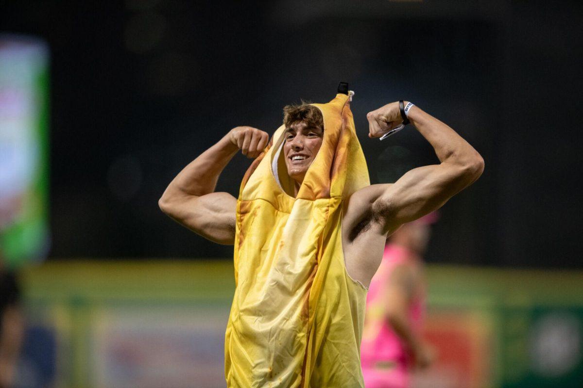 A Savannah Bananas fan flexes in a banana costume Thursday, March 14, 2024, during the Savannah Bananas 5-4 loss to the Party Animals during their world tour stop at Alex Box Stadium in Baton Rouge, La.