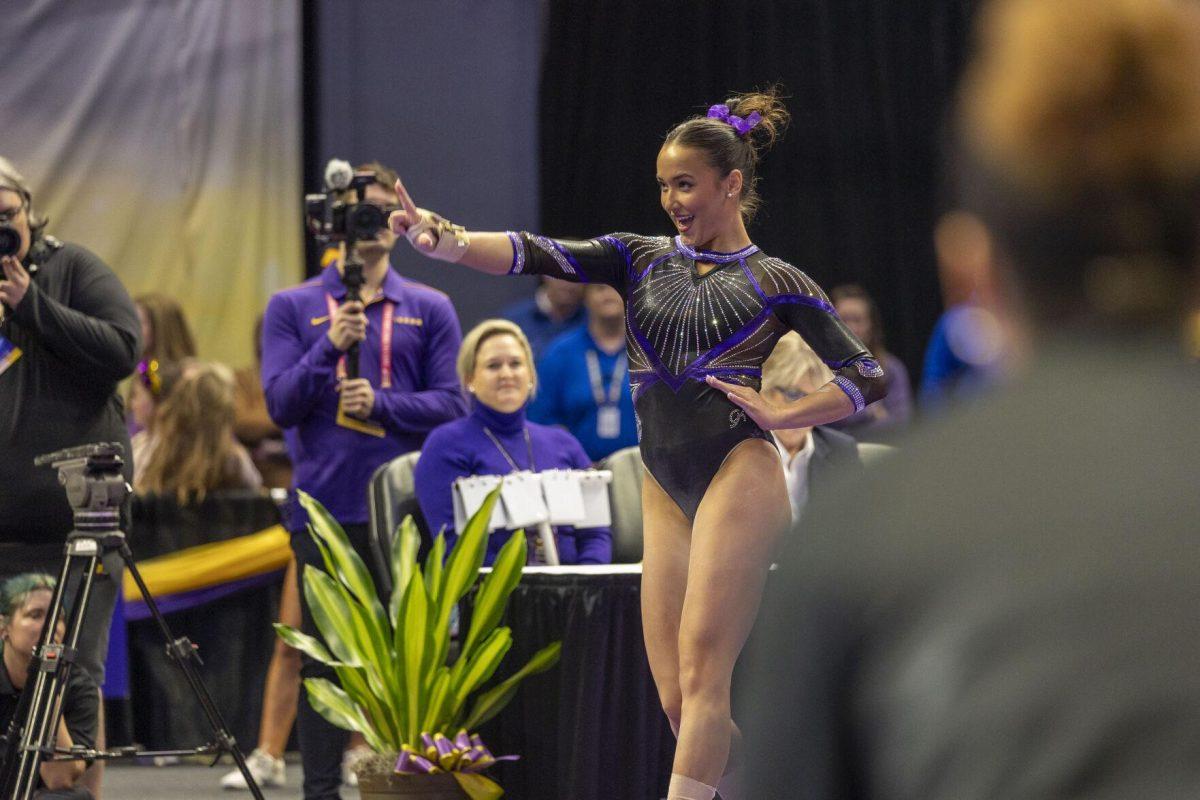 LSU gymnastics junior all-around Aleah Finnegan puts up a "L" during her floor exercise Friday, March 1, 2024, during LSU's 198.325-197.325 win over Alabama in the Pete Maravich Assembly Center.