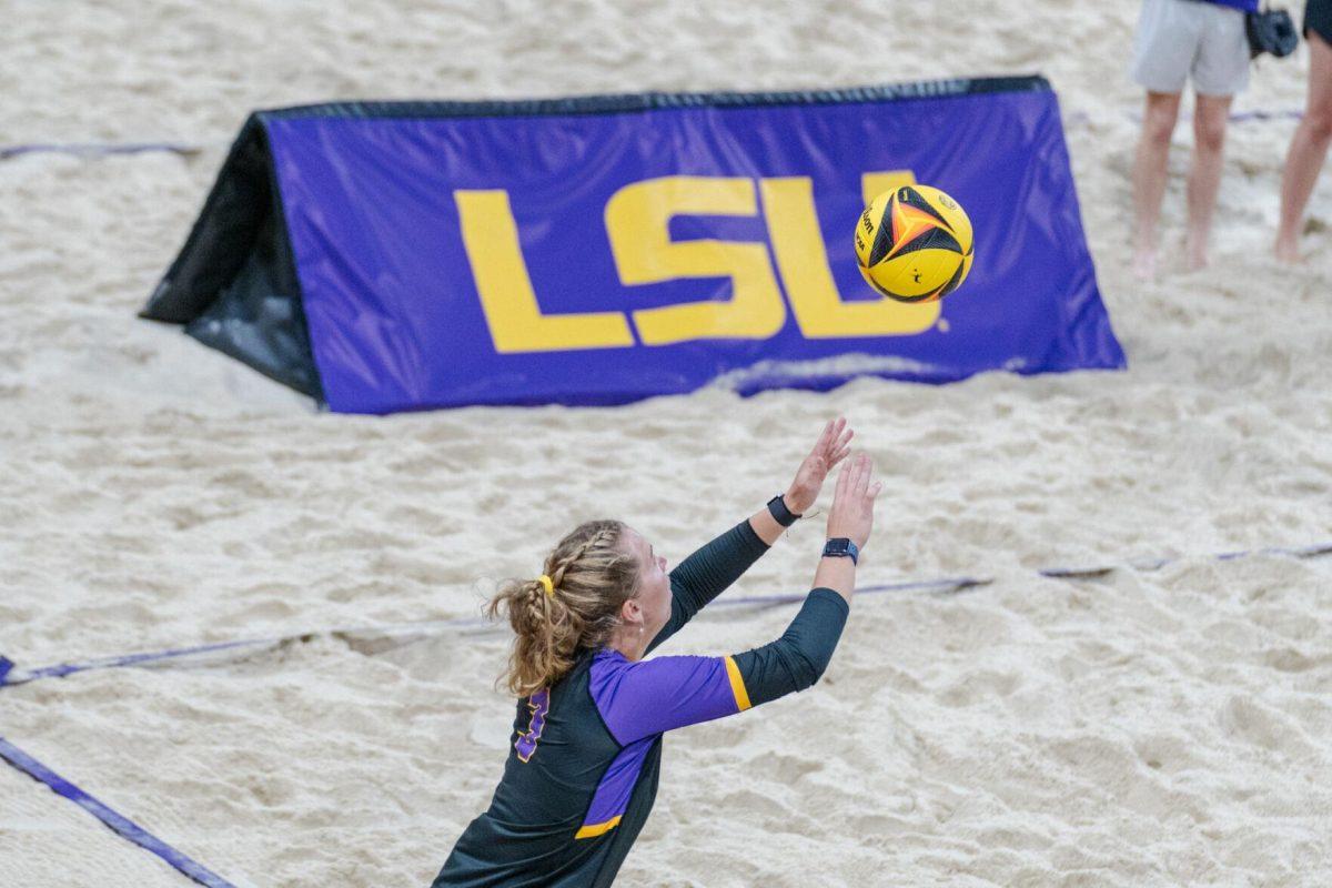 LSU beach volleyball junior Ella Larkin (3) serves the ball Saturday, March 2, 2024, during LSU&#8217;s 5-0 win against Nebraska at the LSU Beach Volleyball Stadium in Baton Rouge, La.