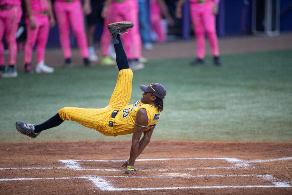 The Savannah Banana's first base coach and choerographer Maceo Harrison break dances Thursday, March 14, 2024, before the Savannah Bananas 5-4 loss to the Party Animals during their world tour stop at Alex Box Stadium in Baton Rouge, La.