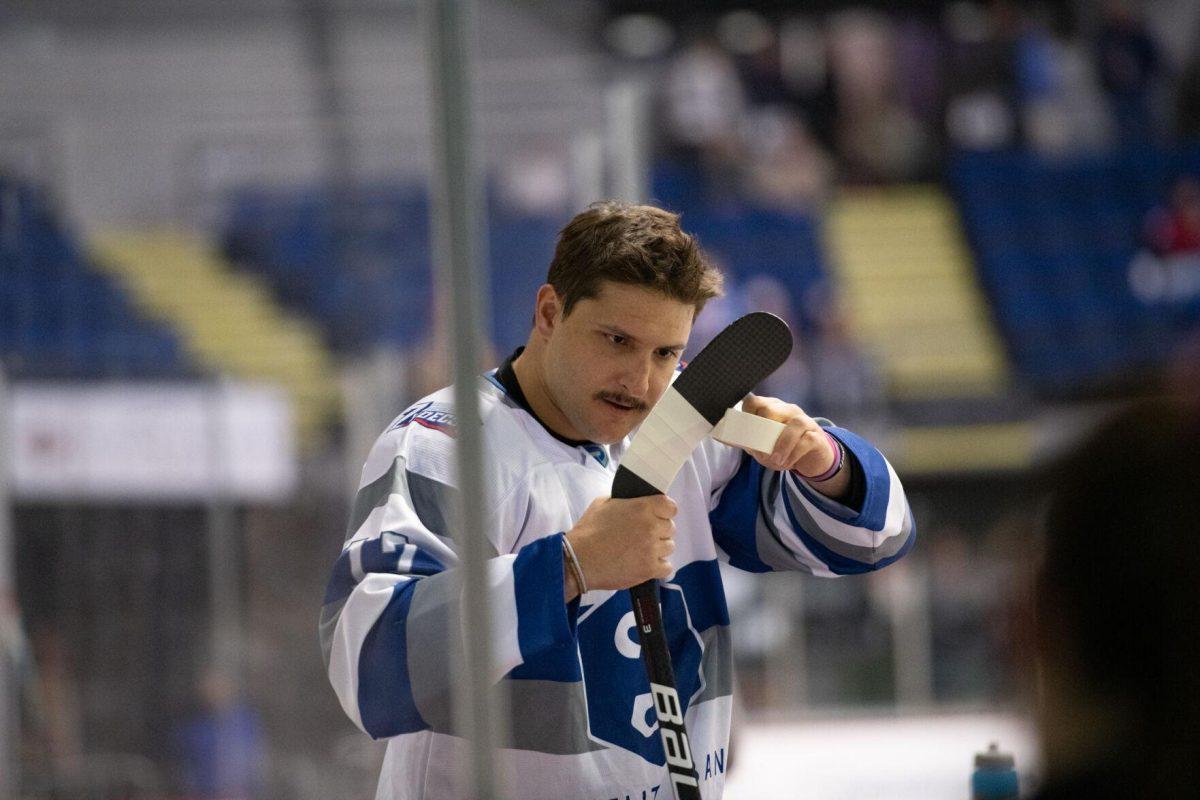 Baton Rouge Zydeco hockey rookie forward Noah Robinson (17) tapes his hockey stick Thursday, Feb. 29, 2024, before Zydeco's 5-3 win against the Carolina Thunderbirds at the Raising Canes River Center in Baton Rouge, La.