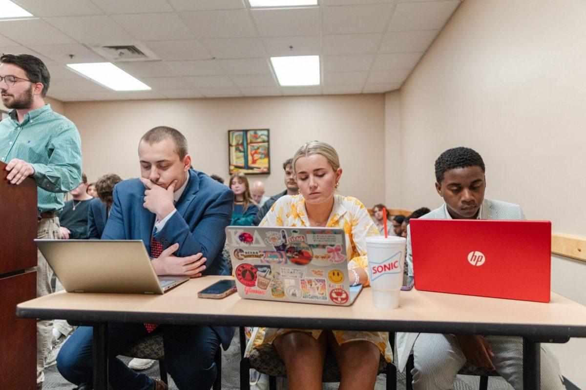 John-Michael Shiner, Anna Kate Jackson and Lavar Henderson listen to Cooper Ferguson's statements Monday, March 25, 2024, inside the LSU Student Union.