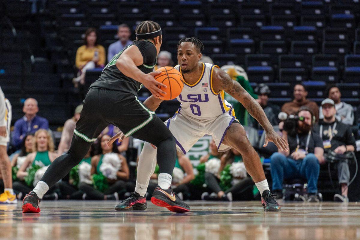 LSU men&#8217;s basketball 5th-year senior guard Trae Hannibal (0) guards his opponent Tuesday, March 19, 2024, during LSU&#8217;s 84-77 loss to the University of North Texas at the PMAC in Baton Rouge, La.