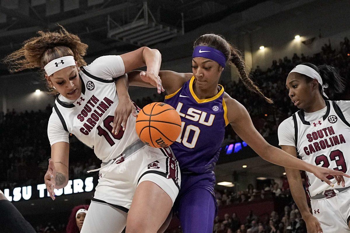 <p>South Carolina center Kamilla Cardoso vies for the ball with LSU forward Angel Reese during the first half of an NCAA college basketball game at the Southeastern Conference women's tournament final Sunday, March 10, 2024, in Greenville, S.C. (AP Photo/Chris Carlson)</p>