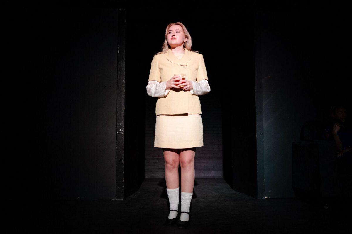 Older Nich Carraway (Sophie Rollins) speaks in a production of Yearning Sunday, March 3, 2024, in Coates Hall on LSU's campus.