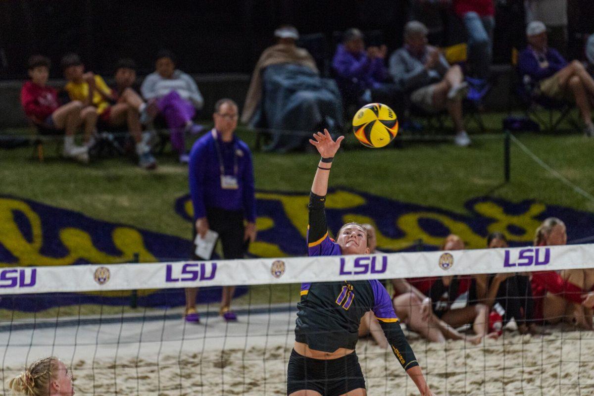 LSU beach volleyball graduate student Gabi Bailey (11) hits the ball Saturday, March 2, 2024, during LSU&#8217;s 5-0 win against Nebraska at the LSU Beach Volleyball Stadium in Baton Rouge, La.