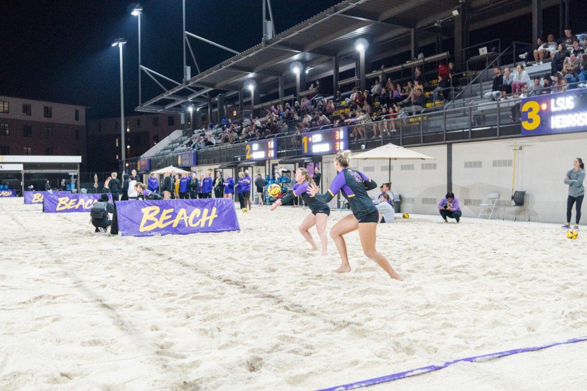 LSU beach volleyball redshirt freshman Kate Baker (8) receives the serve Saturday, March 2, 2024, during LSU&#8217;s 5-0 win against Nebraska at the LSU Beach Volleyball Stadium in Baton Rouge, La.