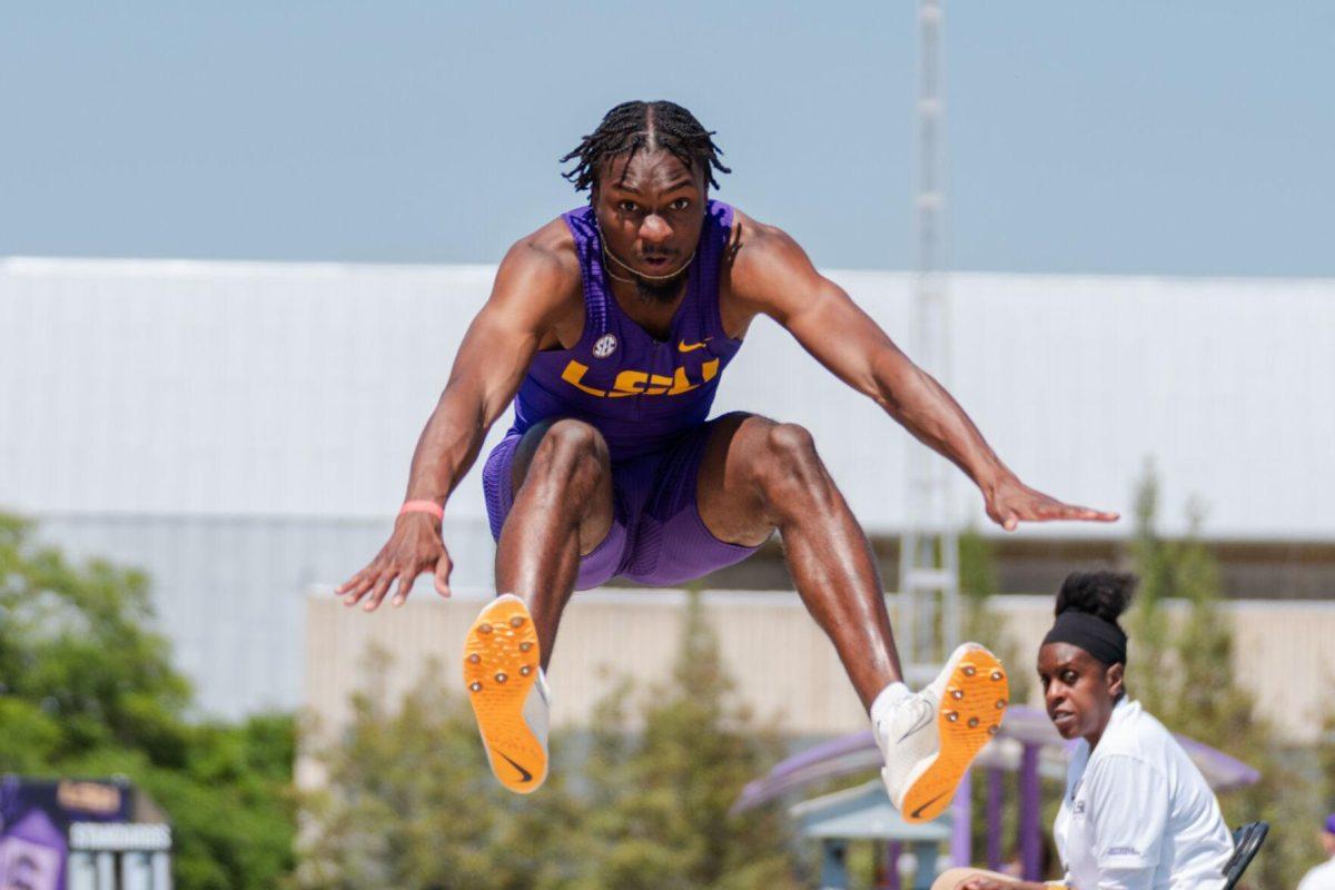 LSU track and field jumps senior Ji'eem Bullock flies through the air Saturday, March 23, 2024, during the Keyth Talley Invitational at the Bernie Moore Track Stadium in Baton Rouge, La.