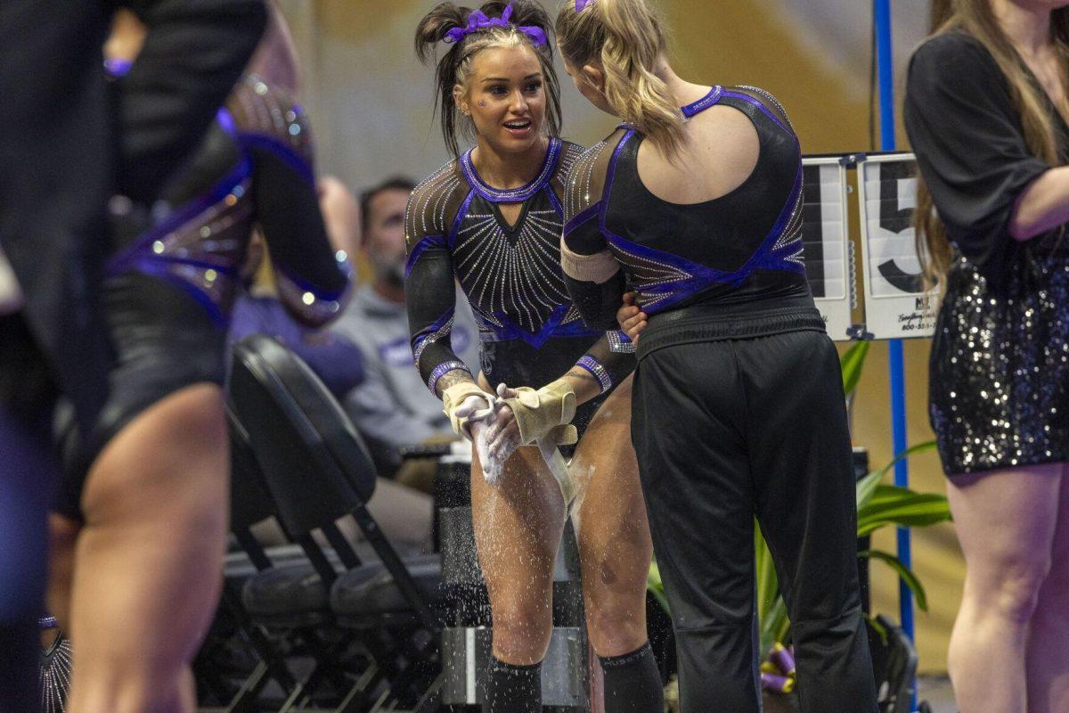 LSU gymnastics junior all-around KJ Johnson has a conversation with graduate student Sierra Ballard Friday, March 1, 2024, during LSU's 198.325-197.325 win over Alabama in the Pete Maravich Assembly Center.