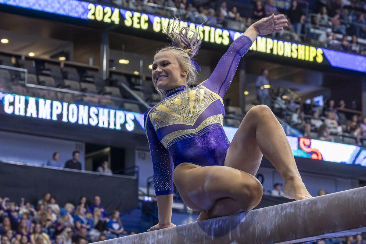 LSU gymnastics graduate student vault/ balance beam/ floor exercise Sierra Ballard strikes a pose Saturday, March 23, 2024, during LSU's 198.075 victory in the 2024 SEC Gymnastics Championship in the Smoothie King Center in New Orleans, La.