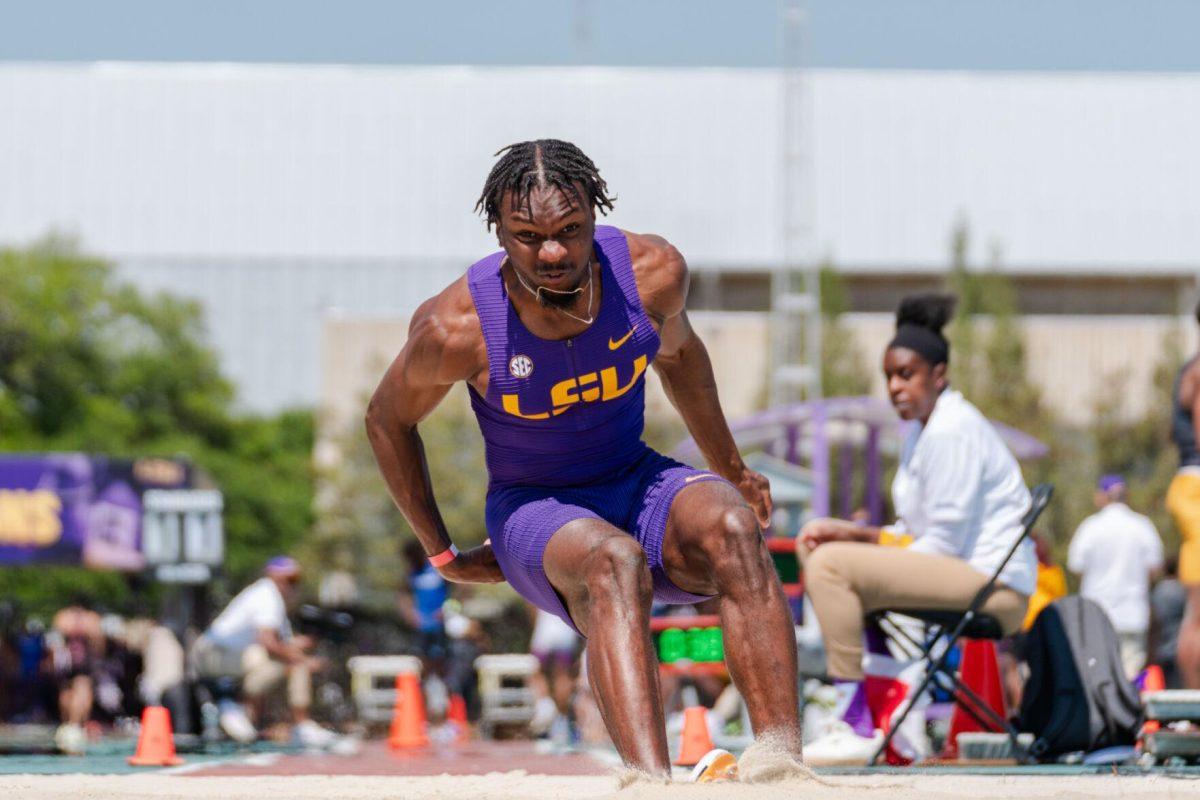 LSU track and field jumps senior Ji'eem Bullock lands in the sand Saturday, March 23, 2024, during the Keyth Talley Invitational at the Bernie Moore Track Stadium in Baton Rouge, La.