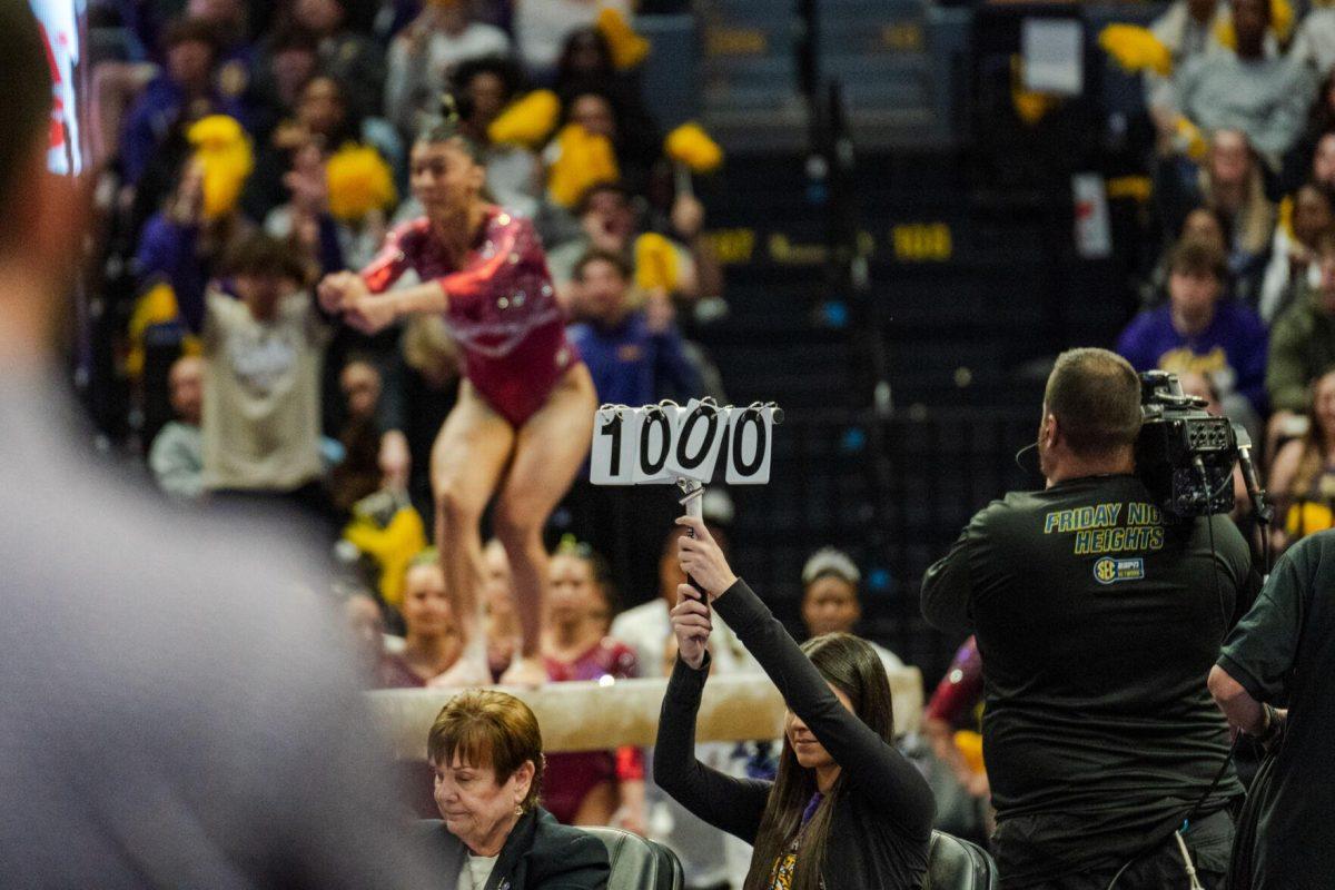 A judge holds up a perfect 10 for Haleigh Bryant Friday, March 1, 2024, during LSU&#8217;s 198.325-197.325 win against Alabama in the Pete Maravich Assembly Center in Baton Rouge, La.