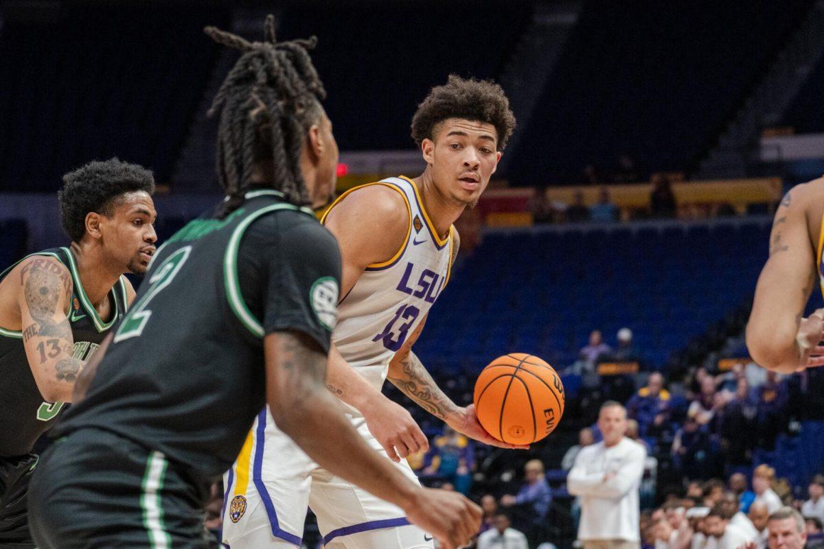 LSU men&#8217;s basketball sophomore forward Jalen Reed (13) holds the ball out Tuesday, March 19, 2024, during LSU&#8217;s 84-77 loss to the University of North Texas at the PMAC in Baton Rouge, La.