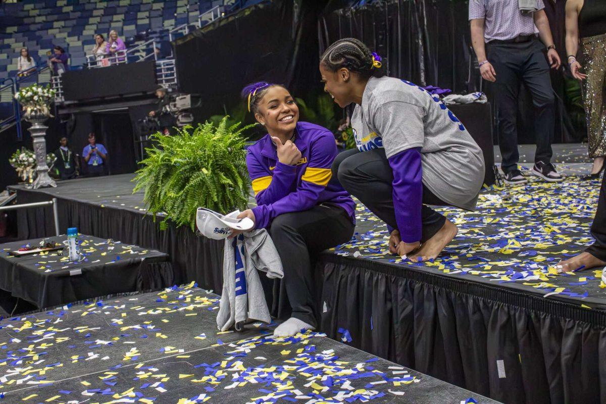 LSU gymnastics graduate student vault/ floor Cammy Hall takes in the moment with freshman all-around Konnor McClain Saturday, March 23, 2024, following LSU's 198.075 victory in the 2024 SEC Gymnastics Championship in the Smoothie King Center in New Orleans, La.