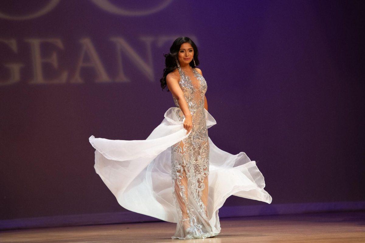 LSU information systems and business management senior Fatimah Avendano twirls in her evening gown Sunday, March 24, 2024, before winning Most Photogenic during Delta Zeta's Miss LSU 2024 Pageant in the Union Theater in Baton Rouge, La.