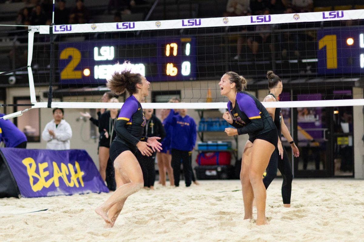 LSU beach volleyball freshman Yali Ashush (26) and senior Emily Meyer (25) celebrate Saturday, March 2, 2024, during LSU's 5-0 win against Nebraska at the LSU Beach Volleyball Stadium in Baton Rouge, La.