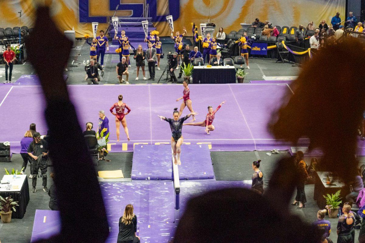 LSU gymnastics all-around senior Haleigh Bryant warms up on the balance beam Friday, March 1, 2024, during LSU&#8217;s meet against Alabama in the Pete Maravich Assembly Center in Baton Rouge, La.