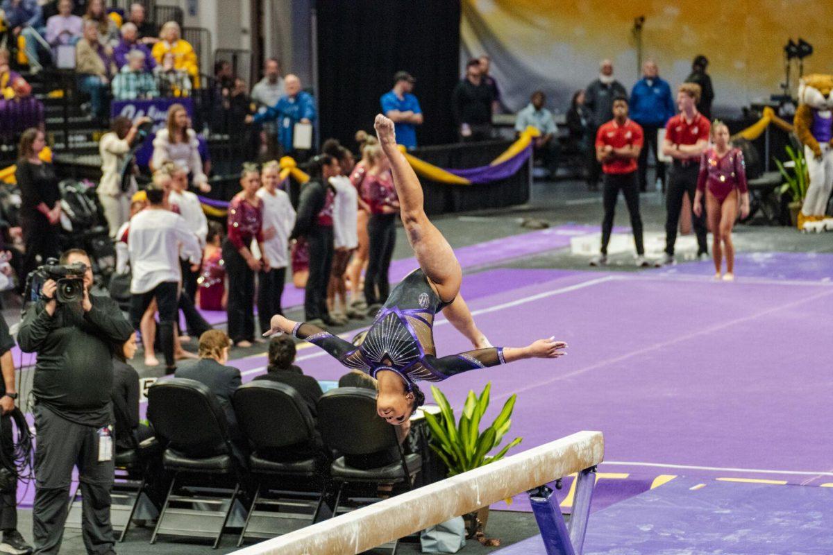 LSU gymnastics all-around freshman Konnor McClain moves through the air Friday, March 1, 2024, during LSU&#8217;s 198.325-197.325 win against Alabama in the Pete Maravich Assembly Center in Baton Rouge, La.