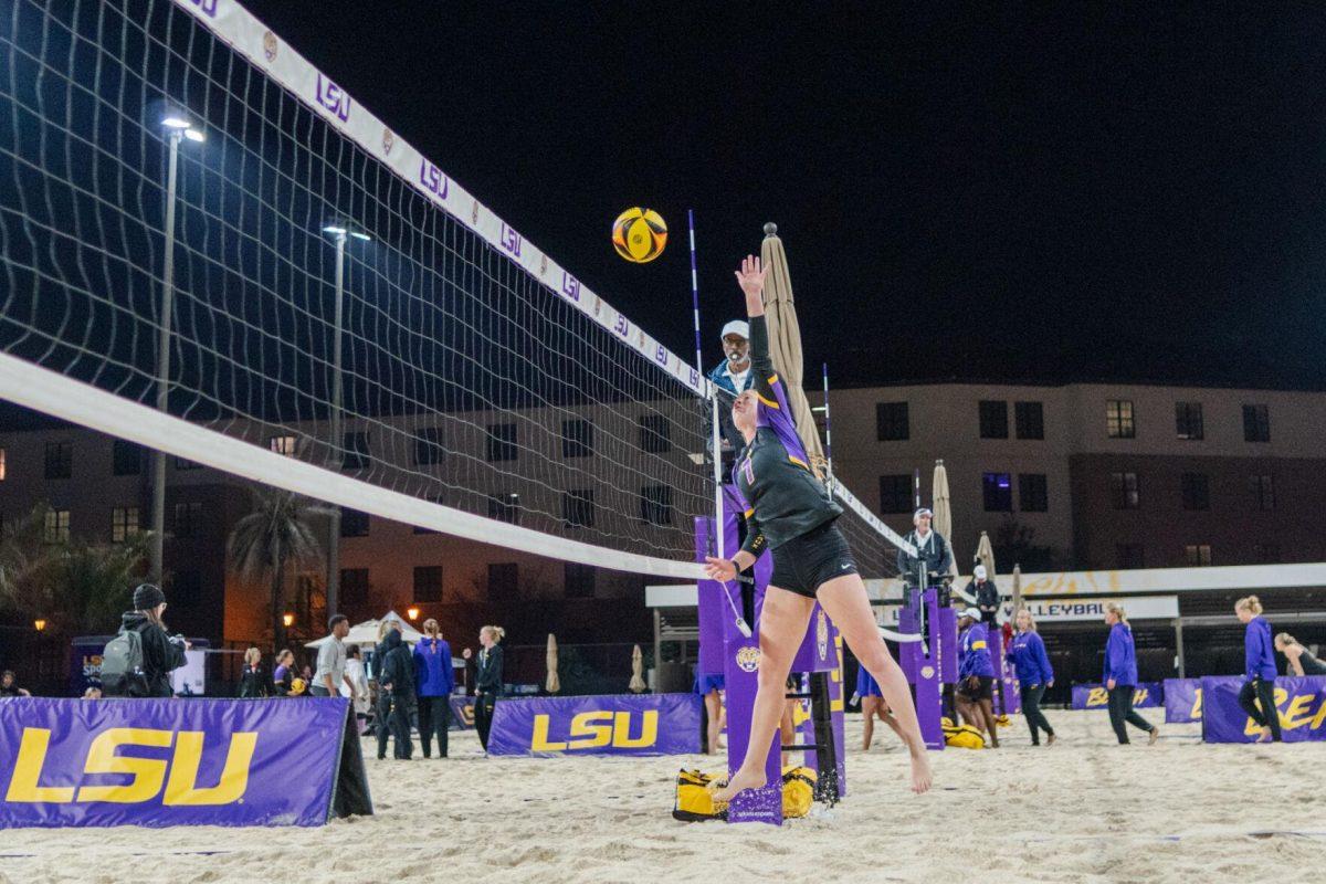 LSU beach volleyball redshirt freshman Kate Baker (8) leaps up to hit the ball Saturday, March 2, 2024, during LSU&#8217;s 5-0 win against Nebraska at the LSU Beach Volleyball Stadium in Baton Rouge, La.