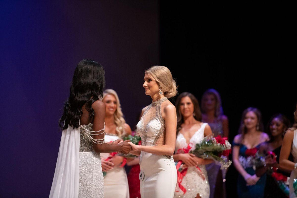 LSU first-year law student Jillian Coco and kinesiology sophomore Nikha Sims await the final results Sunday, March 24, 2024, during Delta Zeta's Miss LSU 2024 Pageant in the Union Theater in Baton Rouge, La.