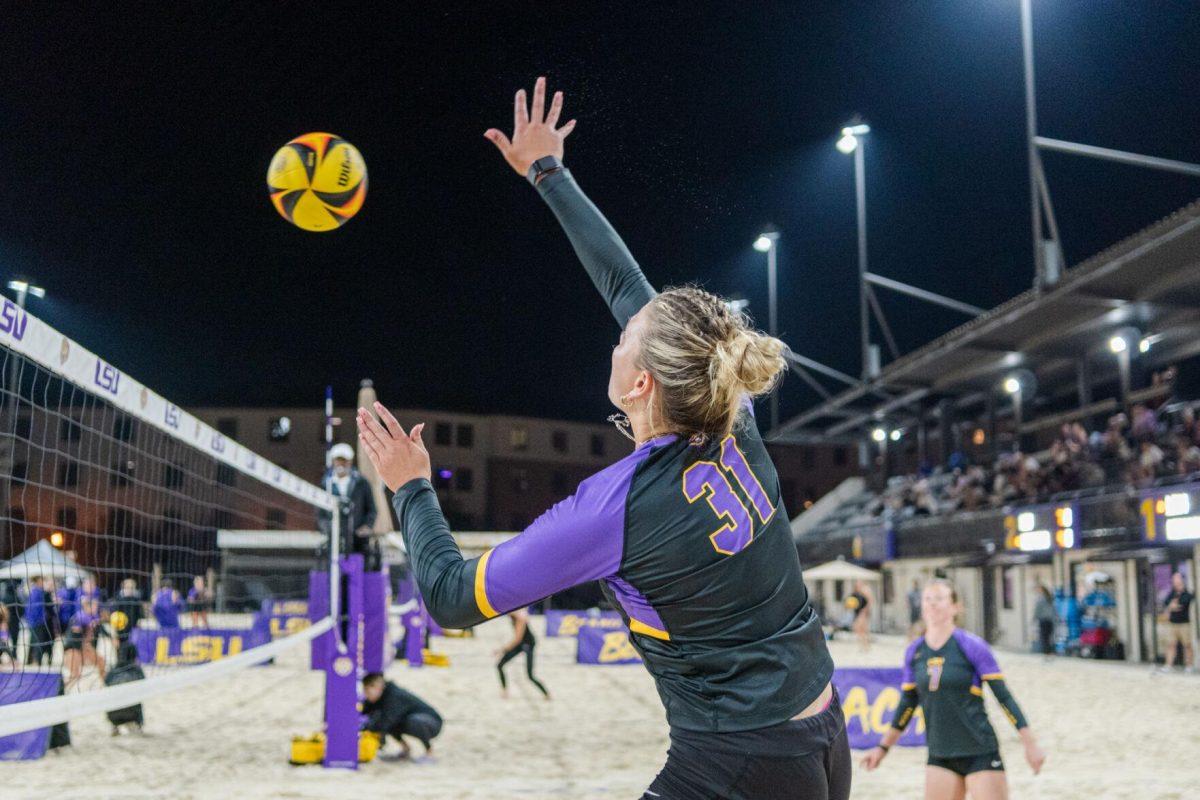 LSU beach volleyball senior Brooke Blutreich (31) hits the ball Saturday, March 2, 2024, during LSU&#8217;s 5-0 win against Nebraska at the LSU Beach Volleyball Stadium in Baton Rouge, La.