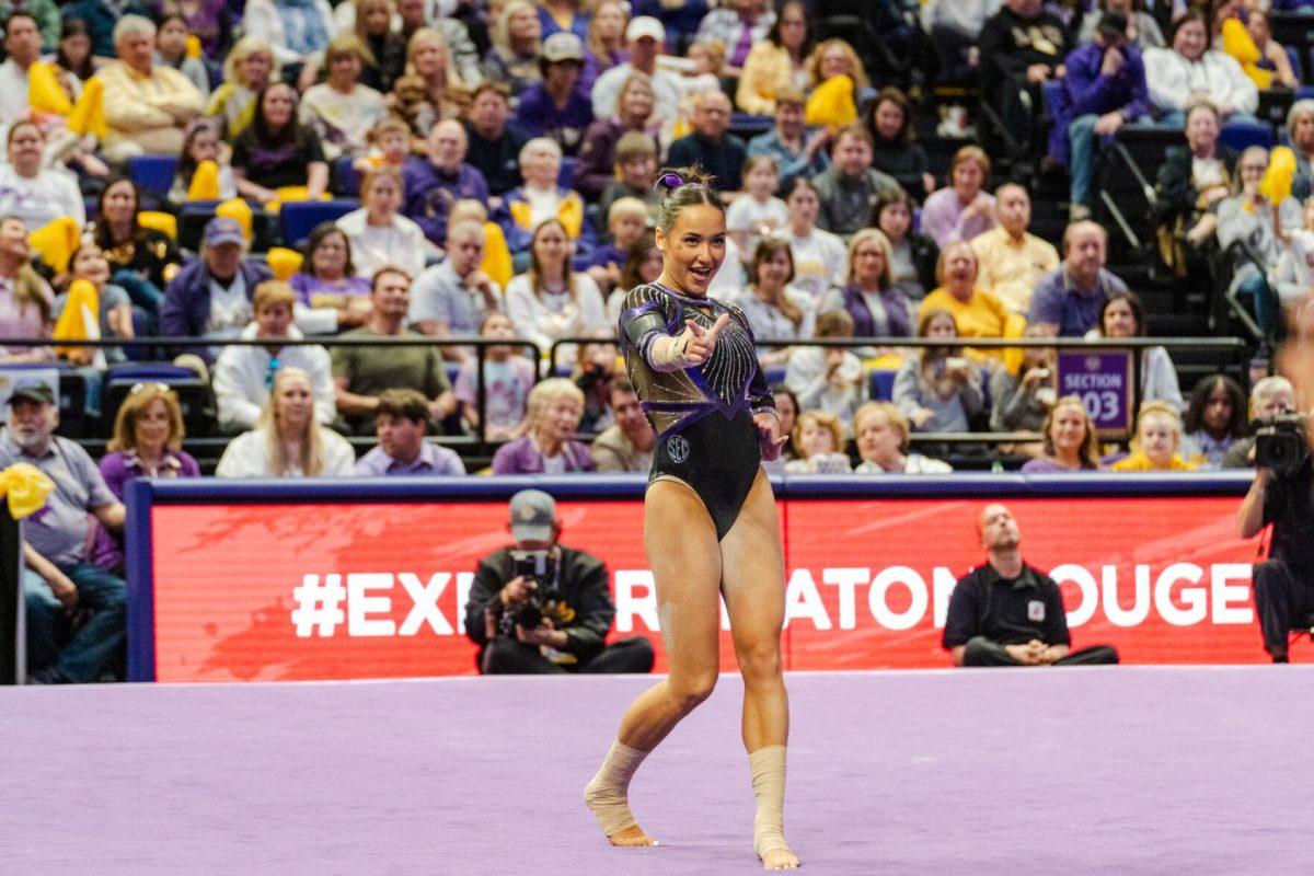 LSU gymnastics all-around junior Aleah Finnegan holds out an "L" Friday, March 1, 2024, during LSU&#8217;s 198.325-197.325 win against Alabama in the Pete Maravich Assembly Center in Baton Rouge, La.