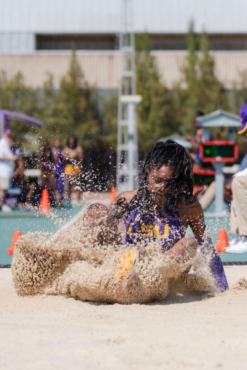 LSU track and field jumps senior Morgan Smalls lands in the snad Saturday, March 23, 2024, during the Keyth Talley Invitational at the Bernie Moore Track Stadium in Baton Rouge, La.