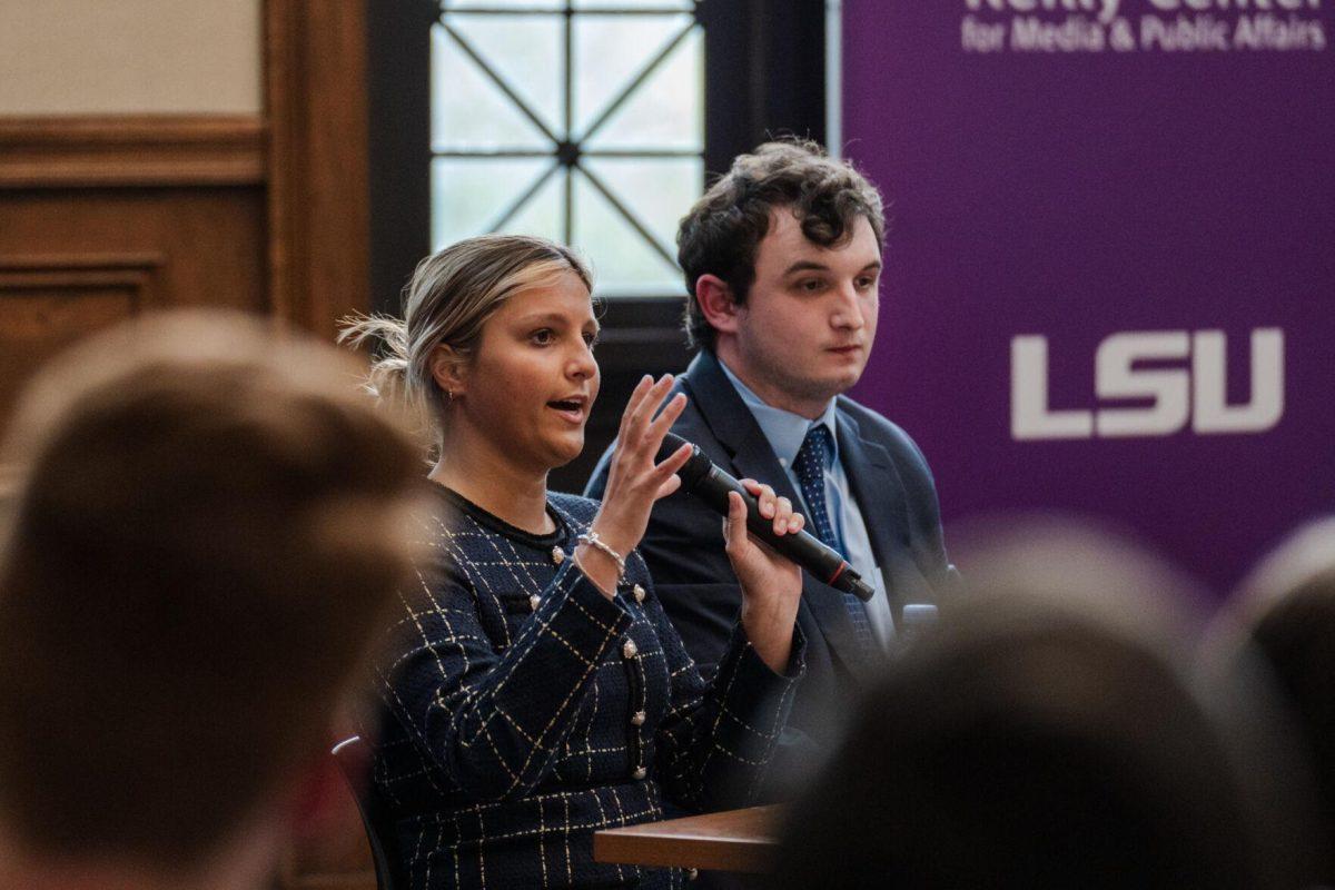 Amelia Carman answers a question as Joseph Liberto listens Monday, March 18, 2024, inside the Holliday Forum at LSU in Baton Rouge, La.