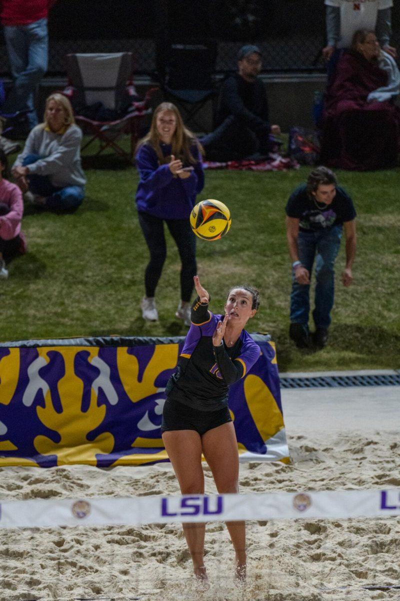 LSU beach volleyball junior Parker Bracken (10) serves the ball Saturday, March 2, 2024, during LSU&#8217;s 5-0 win against Nebraska at the LSU Beach Volleyball Stadium in Baton Rouge, La.