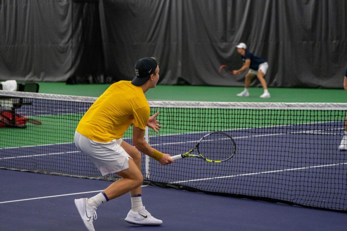 LSU men's tennis junior Julien Penzlin hits a volley during his unfinished 7-6, 5-5 doubles match against Ole Miss Friday, March 8, 2024, at the LSU tennis complex on Gourrier Avenue in Baton Rouge, La.