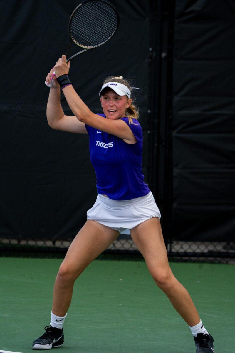 LSU women's tennis freshman Kenna Erickson hits a backhand during her 6-1 doubles win against ULM Sunday, March 3, 2024, at the LSU Tennis Complex on Gourrier Avenue in Baton Rouge, La.