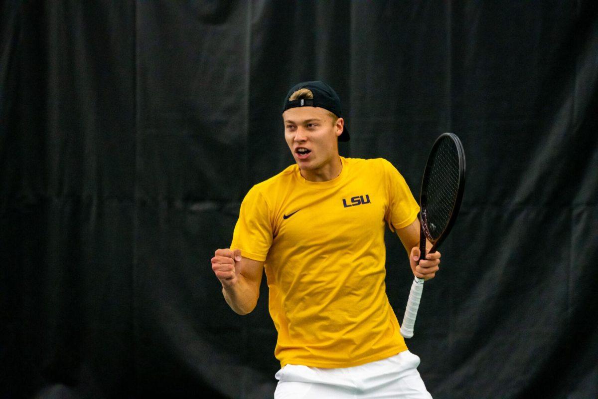 LSU men's tennis freshman Aleksi Lofman pumps his fist during his 5-7 doubles match against Ole Miss Friday, March 8, 2024, at the LSU tennis complex on Gourrier Avenue in Baton Rouge, La.