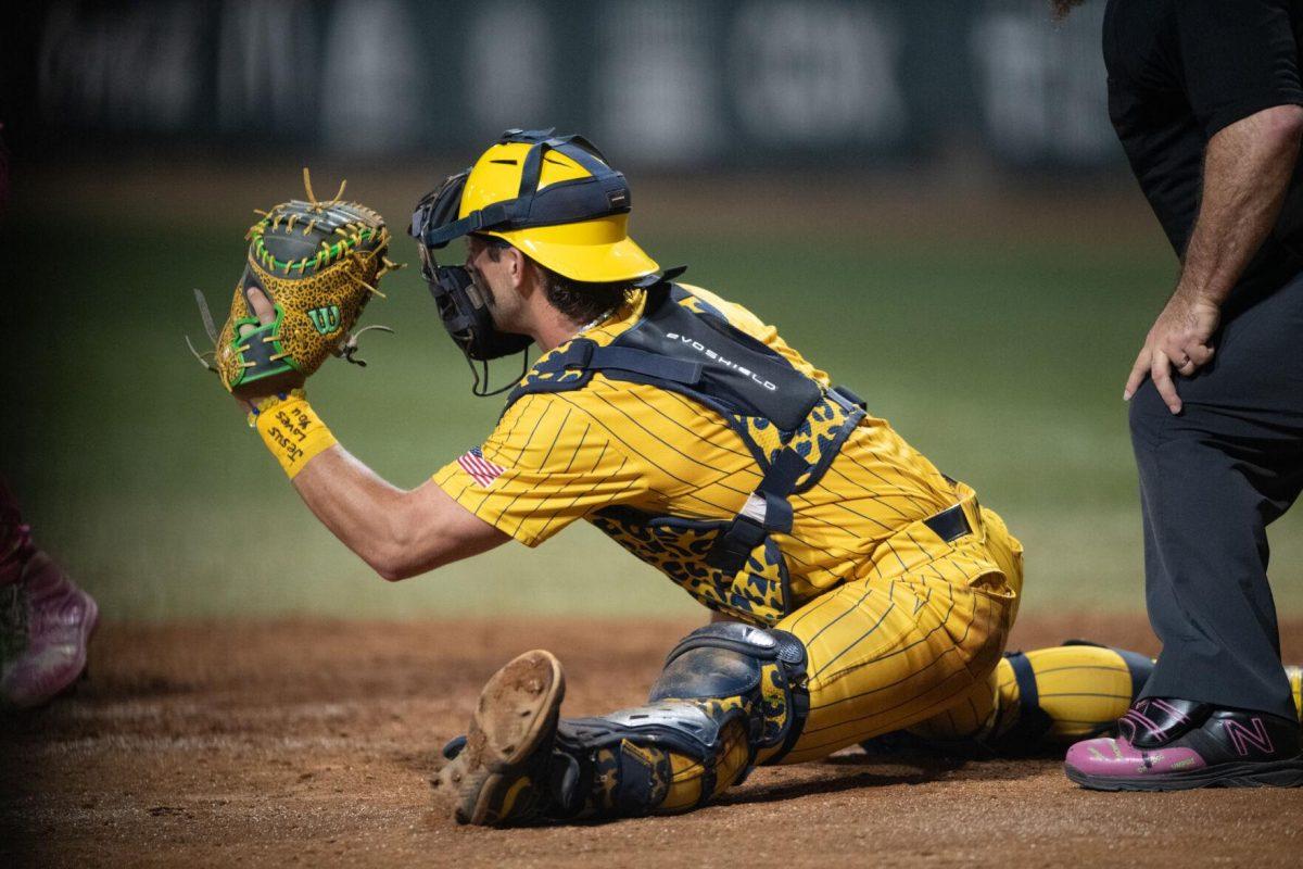 Savannah Bananas catcher Bill Leroy (1) catches the ball while in a split Thursday, March 14, 2024, during the Savannah Bananas 5-4 loss to the Party Animals during their world tour stop at Alex Box Stadium in Baton Rouge, La.