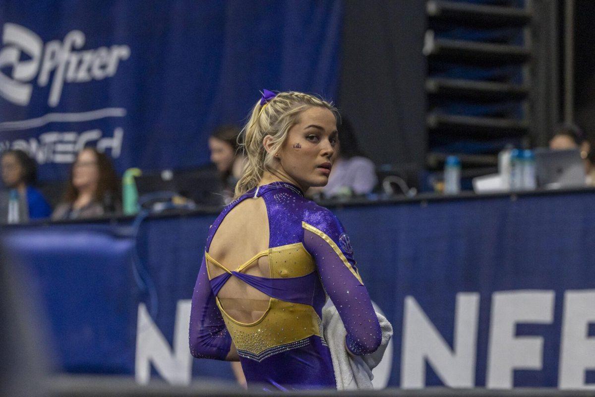LSU gymnastics senior Olivia Dunne prepares for her uneven bars routine Saturday, March 23, 2024, during LSU's 198.075 victory in the 2024 SEC Gymnastics Championship in the Smoothie King Center in New Orleans, La.