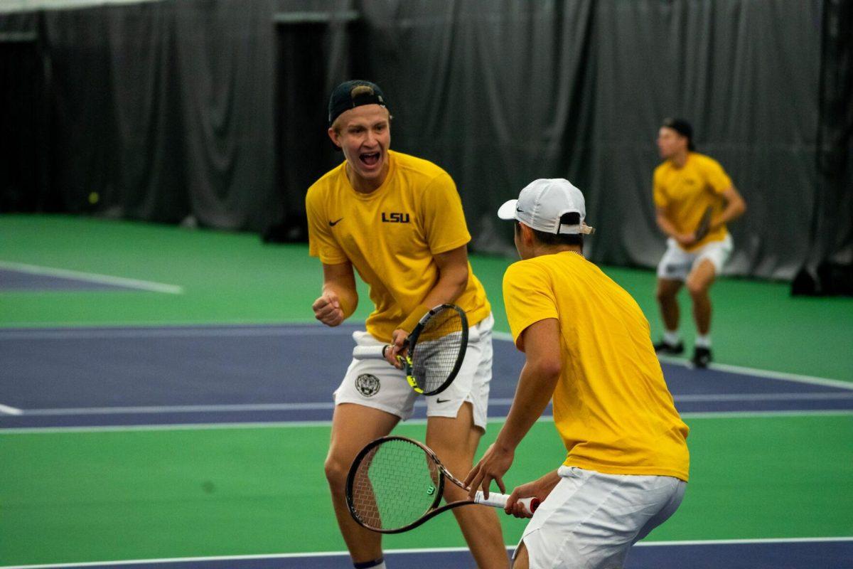 LSU men's tennis junior Julien Penzlin and senior Chen Dong celebrate a point during their unfinished 7-6, 5-5 doubles match against Ole Miss Friday, March 8, 2024, at the LSU tennis complex on Gourrier Avenue in Baton Rouge, La.