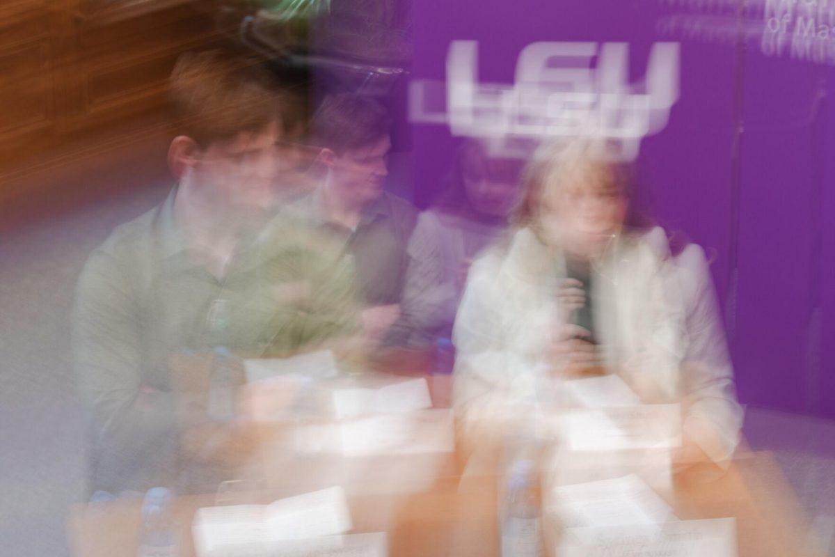 Sydney Smith answers a question as John Michael Sweat listens Monday, March 18, 2024, inside the Holliday Forum at LSU in Baton Rouge, La.