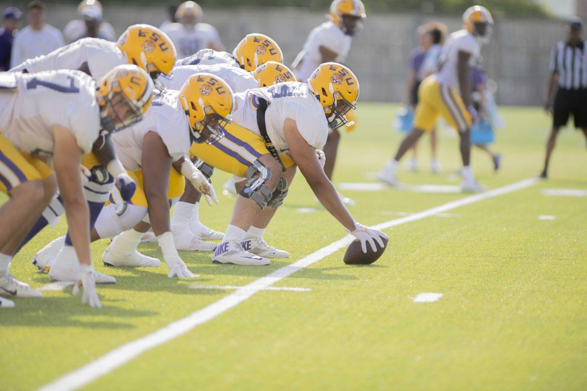 LSU football offense team runs a play Thursday, April 21, 2022, during LSU&#8217;s spring practice in Baton Rouge, Louisiana.