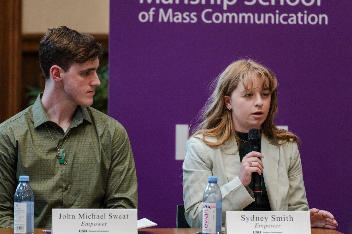 Sydney Smith answers a question as John Michael Sweat listens Monday, March 18, 2024, inside the Holliday Forum at LSU in Baton Rouge, La.