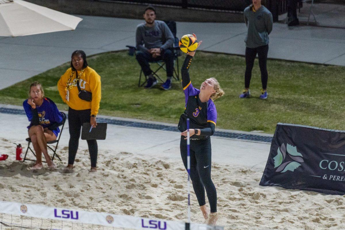 LSU beach volleyball junior Ella Larkin (3) serves the ball Saturday, March 2, 2024, during LSU&#8217;s 5-0 win against Nebraska at the LSU Beach Volleyball Stadium in Baton Rouge, La.