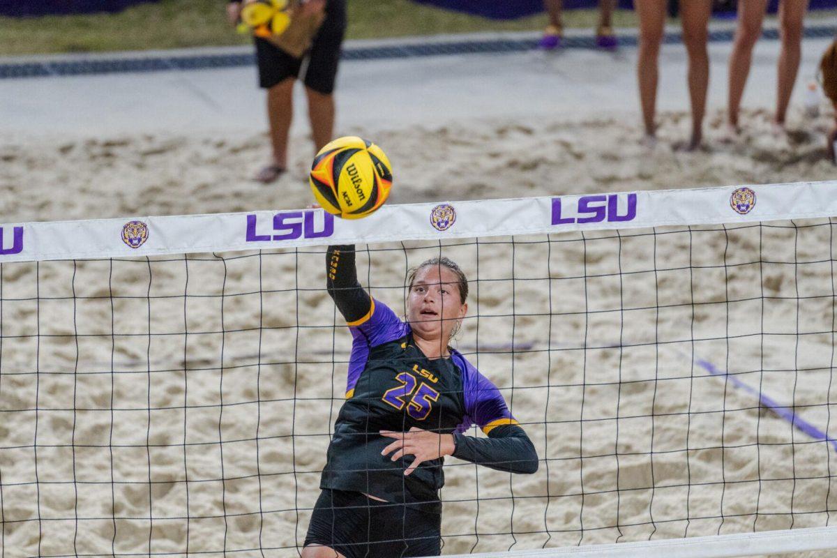 LSU beach volleyball senior Emily Meyer (25) sends the ball over the net Saturday, March 2, 2024, during LSU&#8217;s 5-0 win against Nebraska at the LSU Beach Volleyball Stadium in Baton Rouge, La.