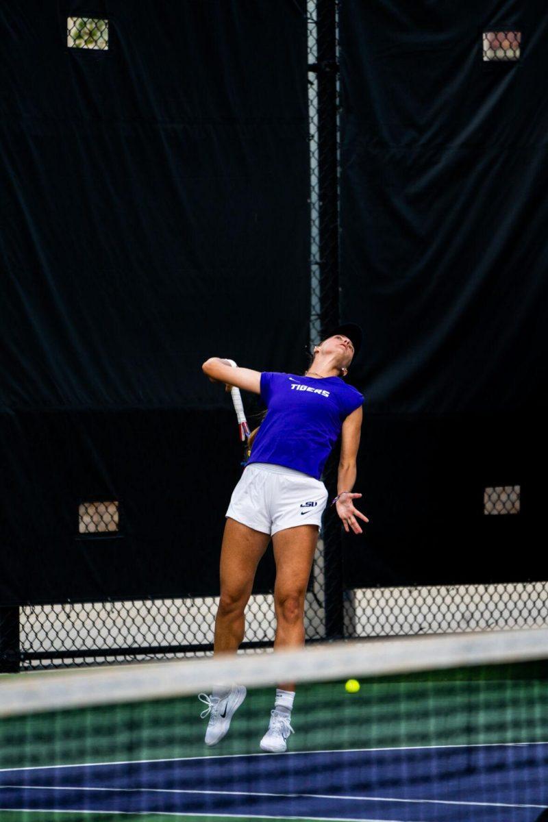 LSU women's tennis graduate student Aran Teixido Garcia hits a serve during her 6-0 doubles win against ULM Sunday, March 3, 2024, at the LSU Tennis Complex on Gourrier Avenue in Baton Rouge, La.