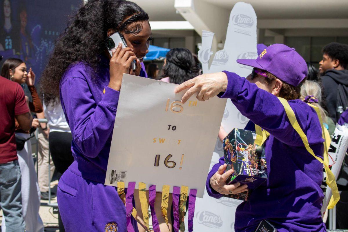 A fan shows off her handmade sign to LSU women's basketball junior forward Amani Bartlett (2) at the Sweet Sixteen Sendoff on Thursday, March 28, 2024, outside the Pete Maravich Assembly Center in Baton Rouge, La.